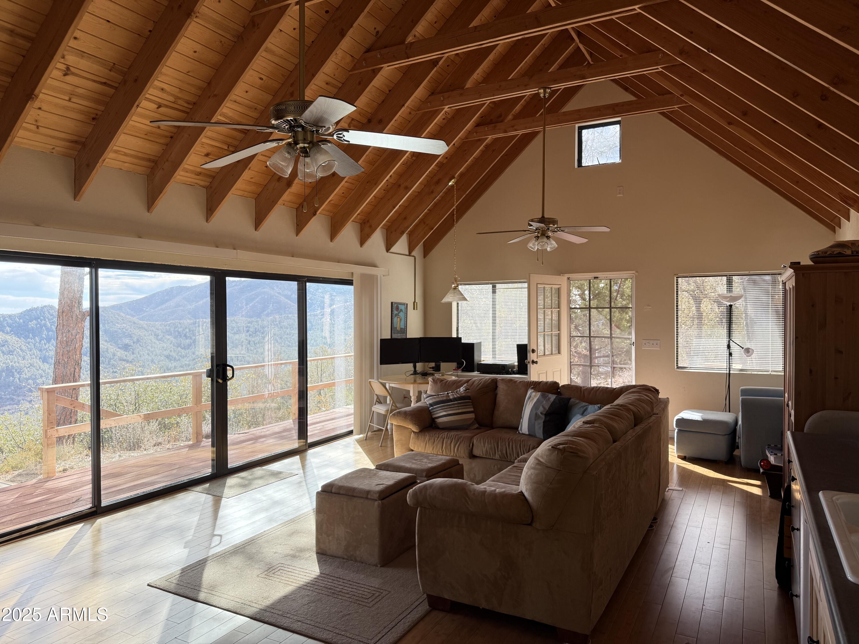 6358 Mountain View Road Crown King, AZ 86343 - Photo 25 of 42 a living room with furniture and a large window