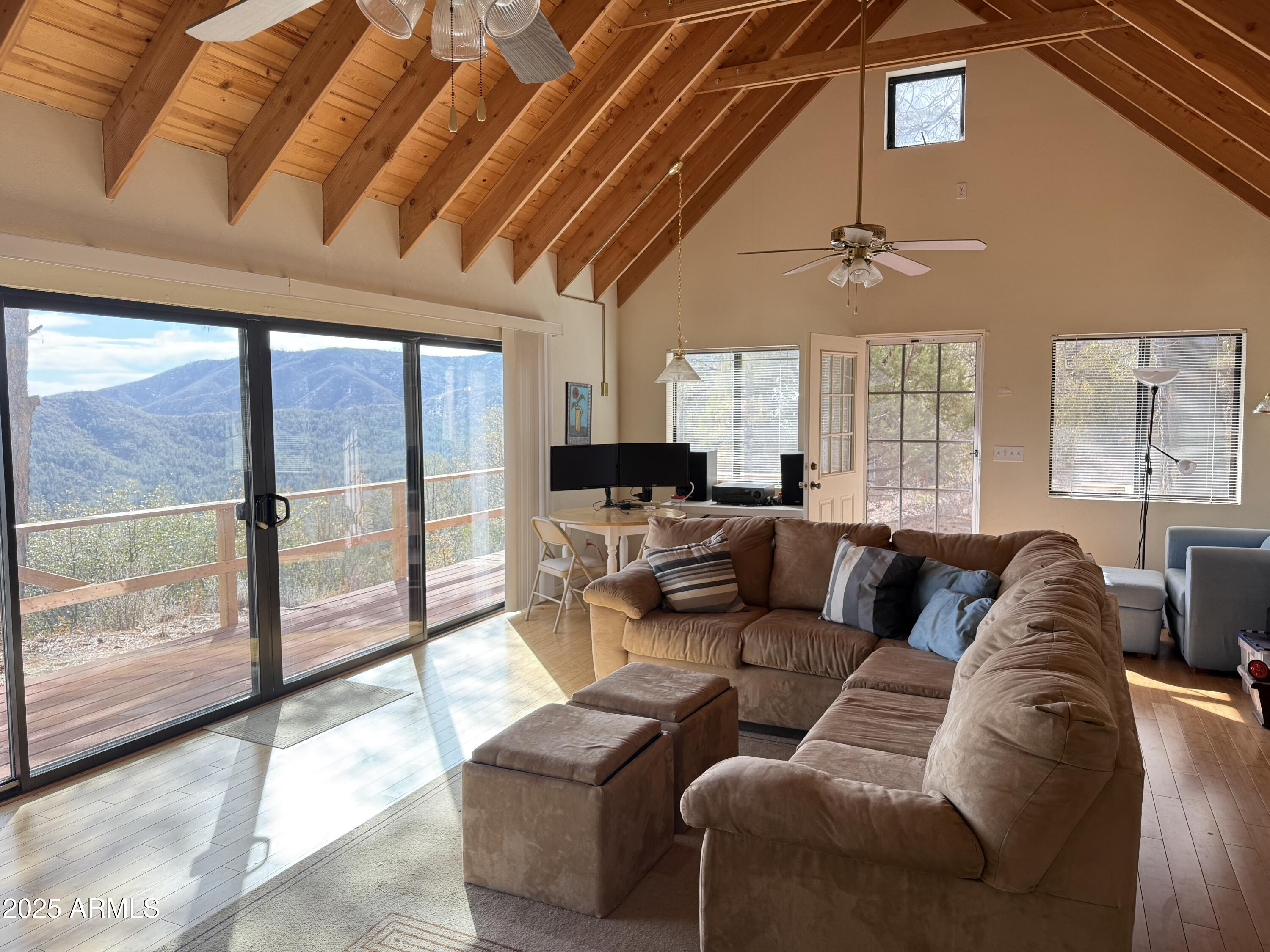 6358 Mountain View Road Crown King, AZ 86343 - Photo 27 of 42 a living room with furniture and a large window