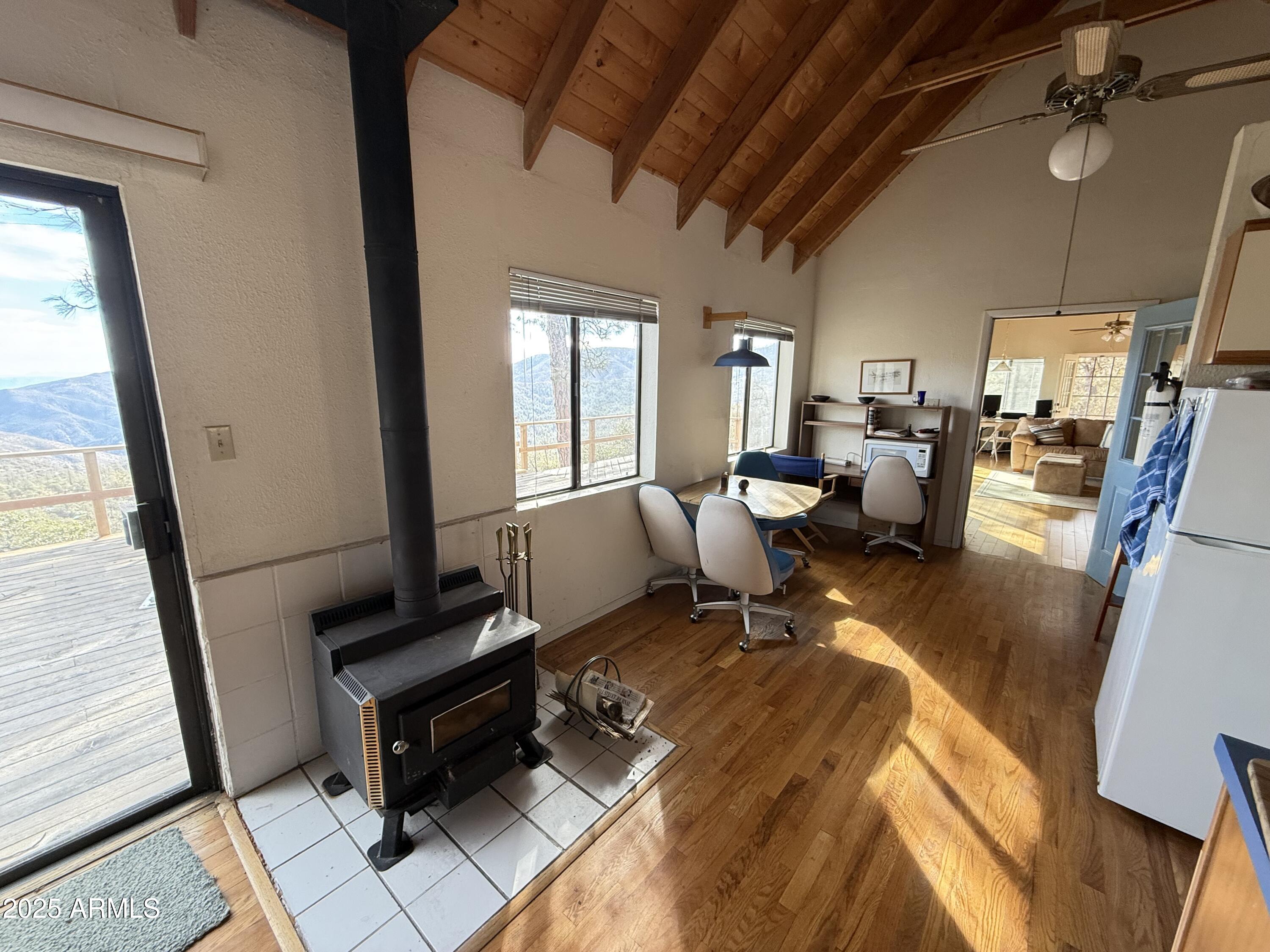 6358 Mountain View Road Crown King, AZ 86343 - Photo 30 of 42 a living room with patio furniture and a fireplace