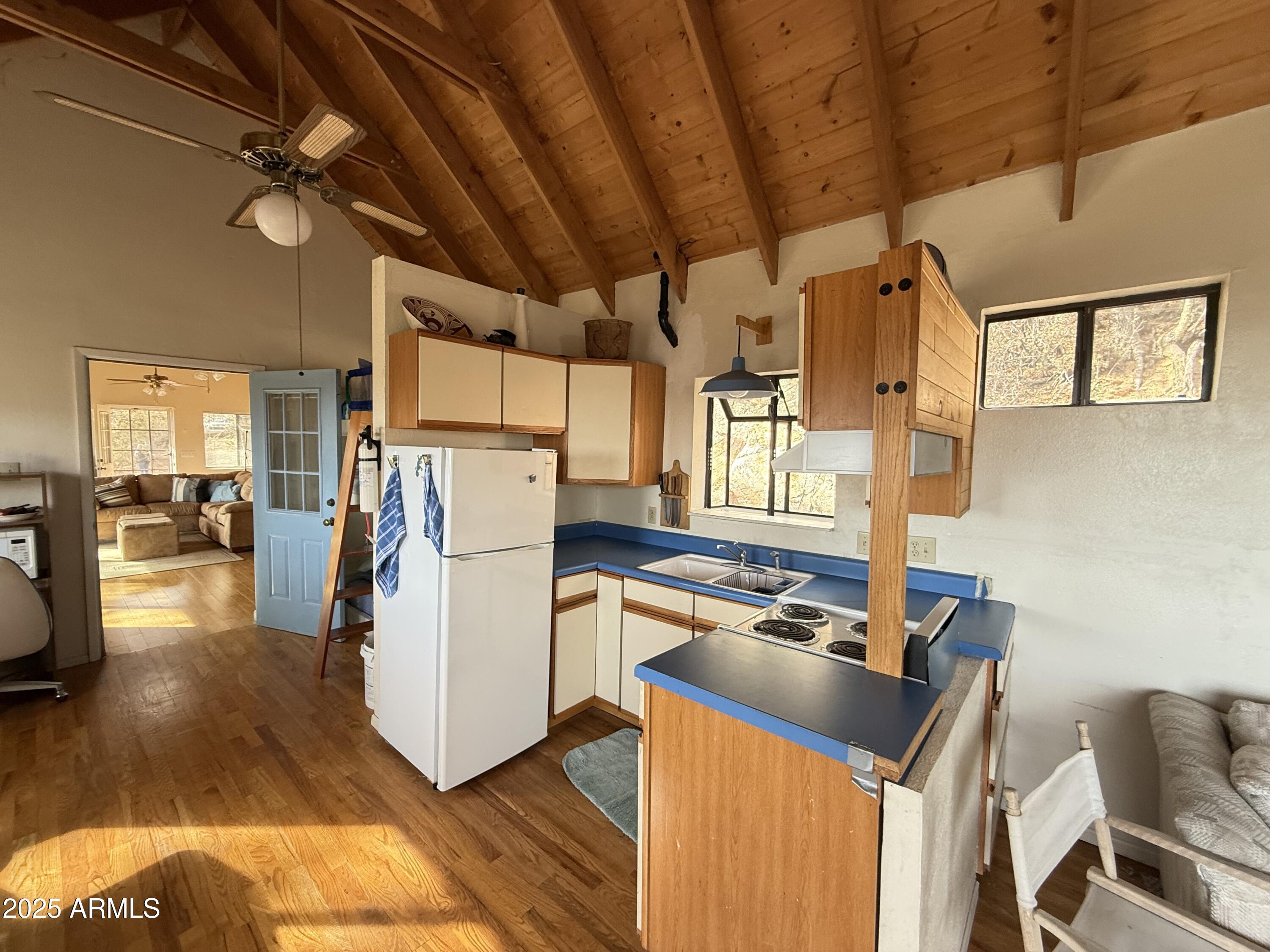 6358 Mountain View Road Crown King, AZ 86343 - Photo 32 of 42 a storage room with wooden floor and furniture