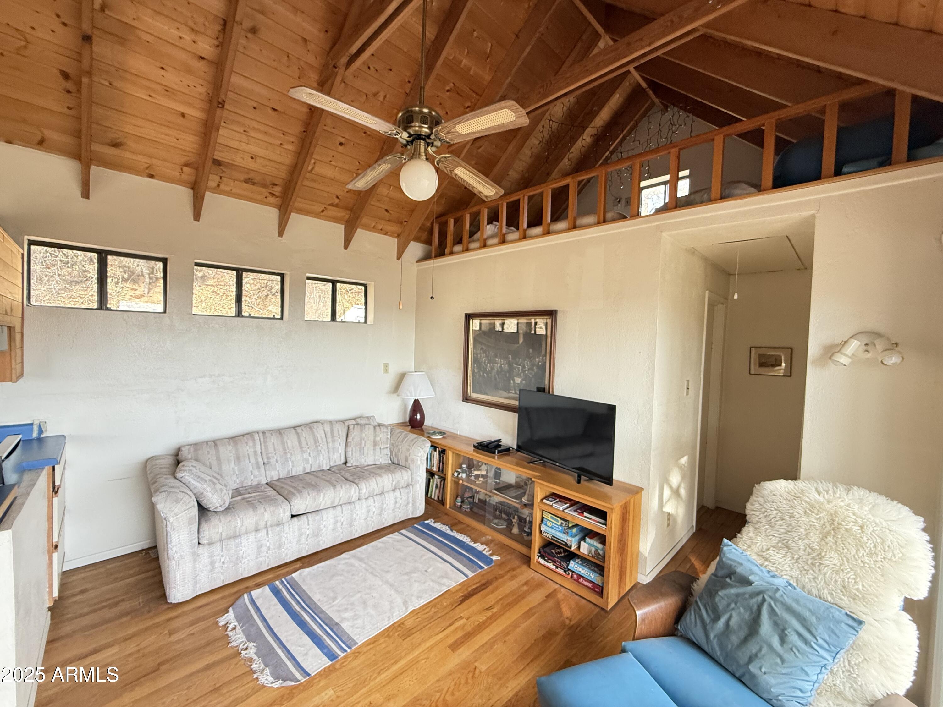 6358 Mountain View Road Crown King, AZ 86343 - Photo 33 of 42 a living room with furniture and a flat screen tv