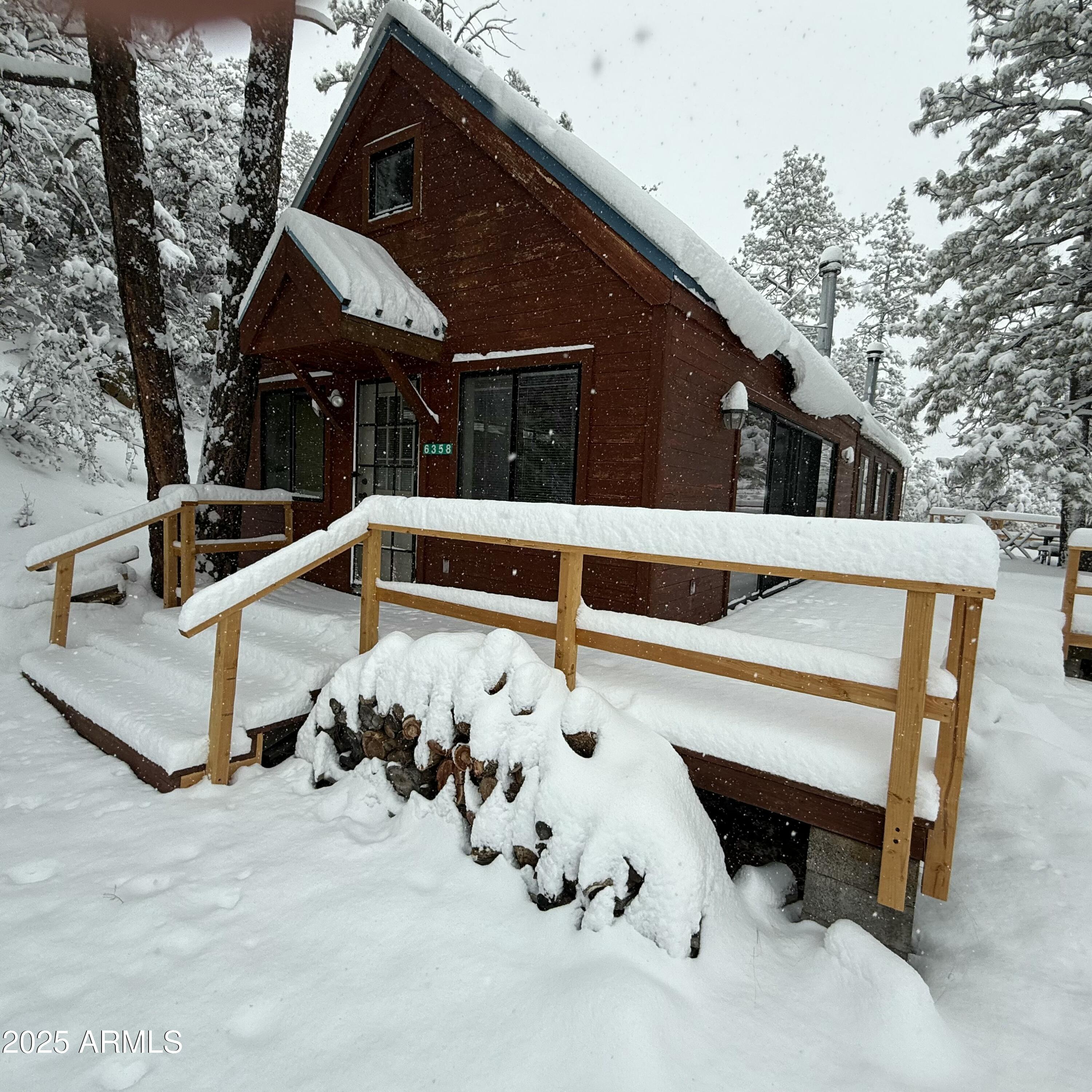 6358 Mountain View Road Crown King, AZ 86343 - Photo 4 of 42 a front view of a house with natural light