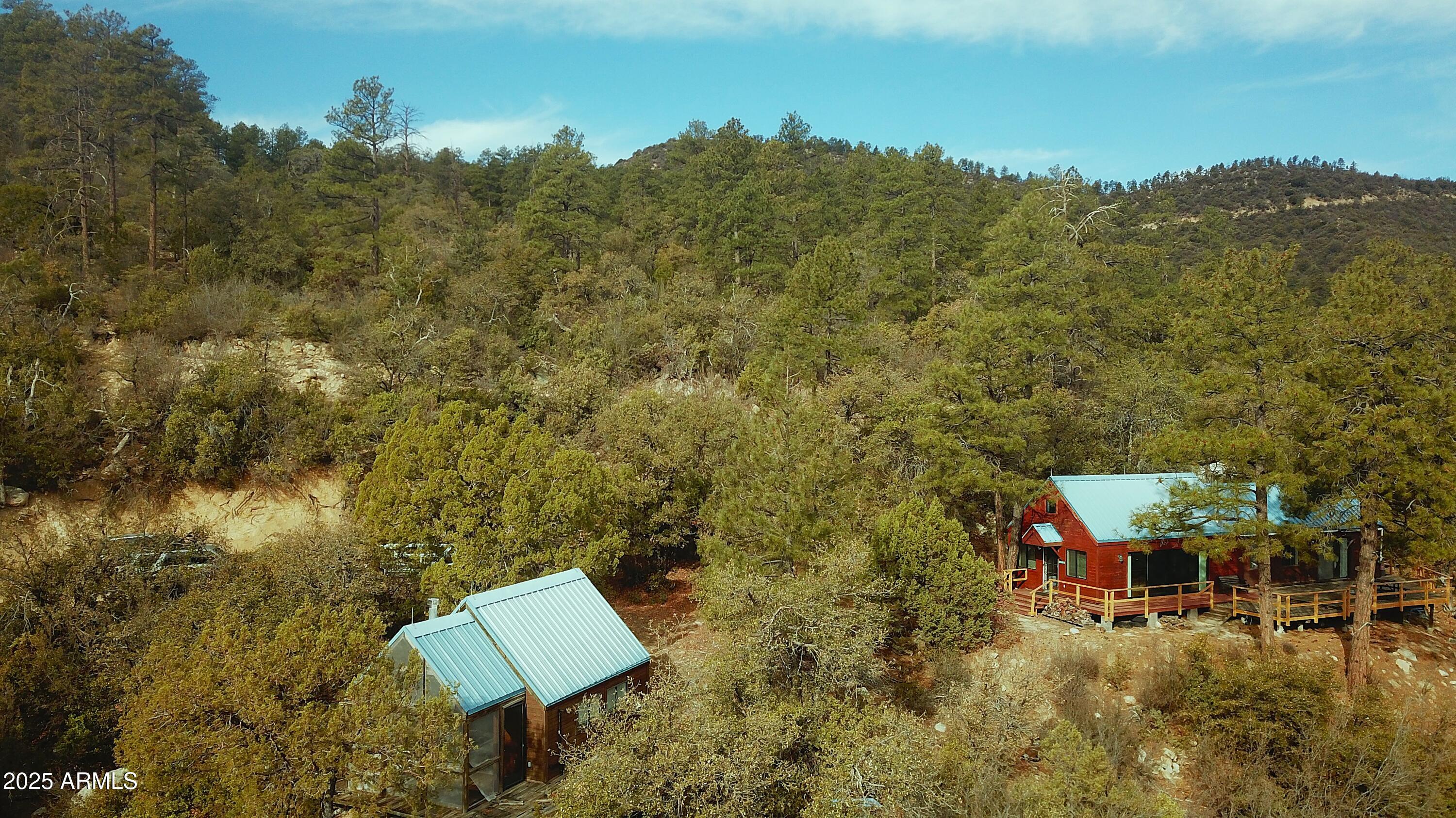 6358 Mountain View Road Crown King, AZ 86343 - Photo 9 of 42 an aerial view of a house with a yard and mountain view in back