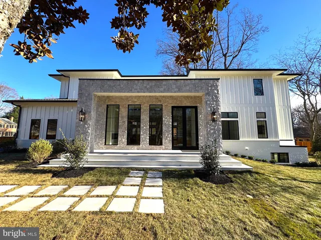 a view of a house with outdoor seating