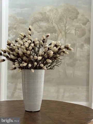 a view of an empty room with a fireplace and a window