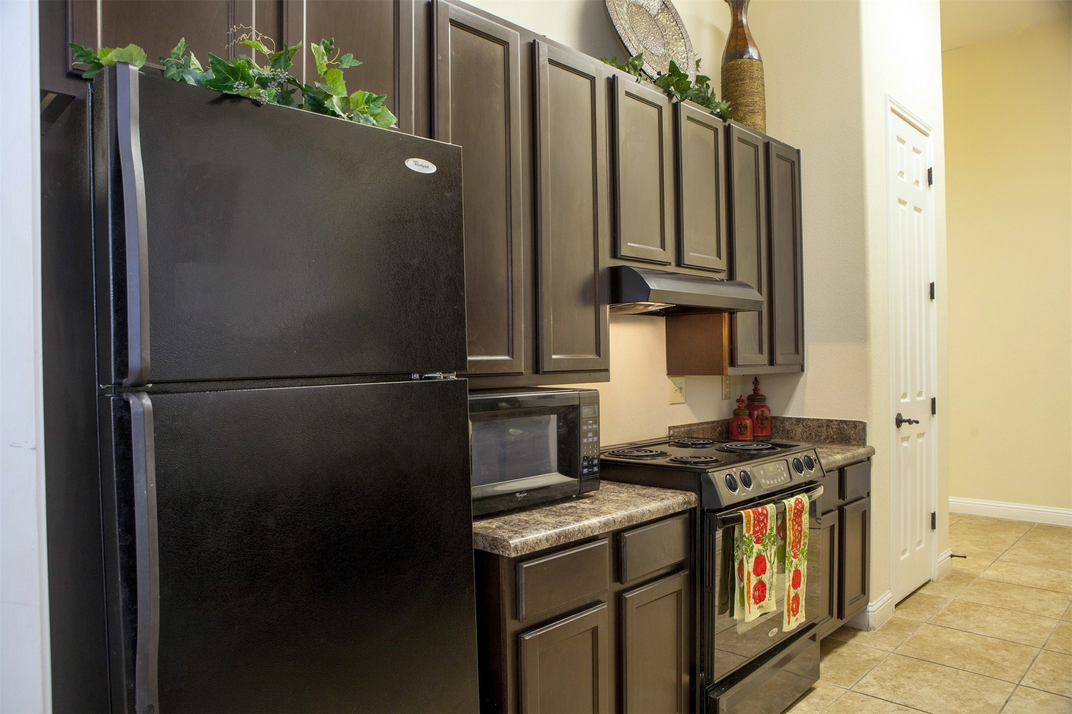 1215 Castroville Road San Antonio, TX 78237 - Photo 13 of 14 a close view of a sink and a refrigerator