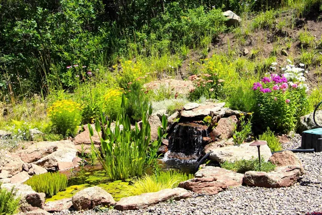 a view of a lake with a house in the background