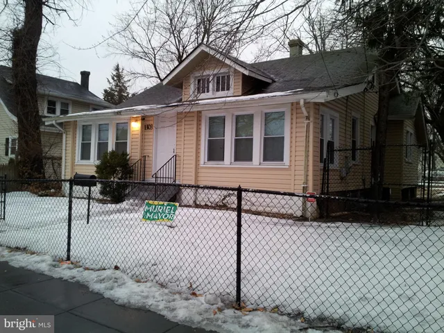 a front view of a house with garage