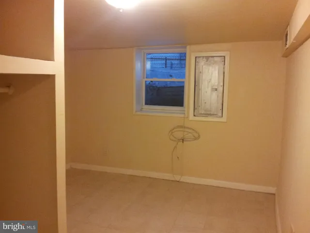 a bathroom with a granite countertop sink and a vanity