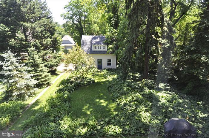 1910 Grace Church Road Silver Spring, MD 20910 - Photo 5 of 16 a view of a house with a tree
