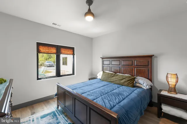 a table room with chairs and potted plant