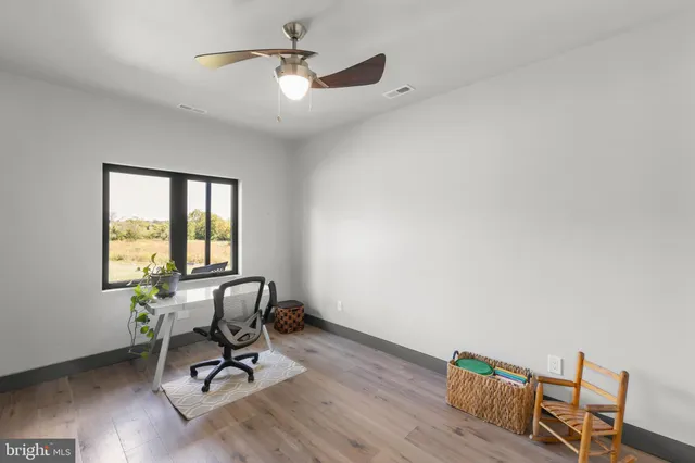 a kitchen with a table and chairs in it