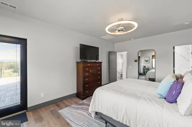 a view of a swimming pool with a yard and a forest