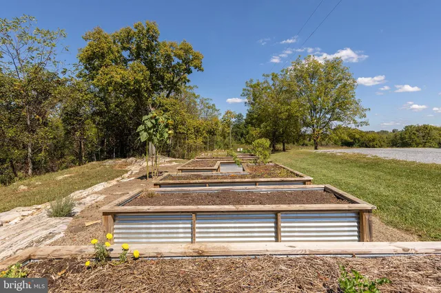 a view of a house with backyard porch and sitting area