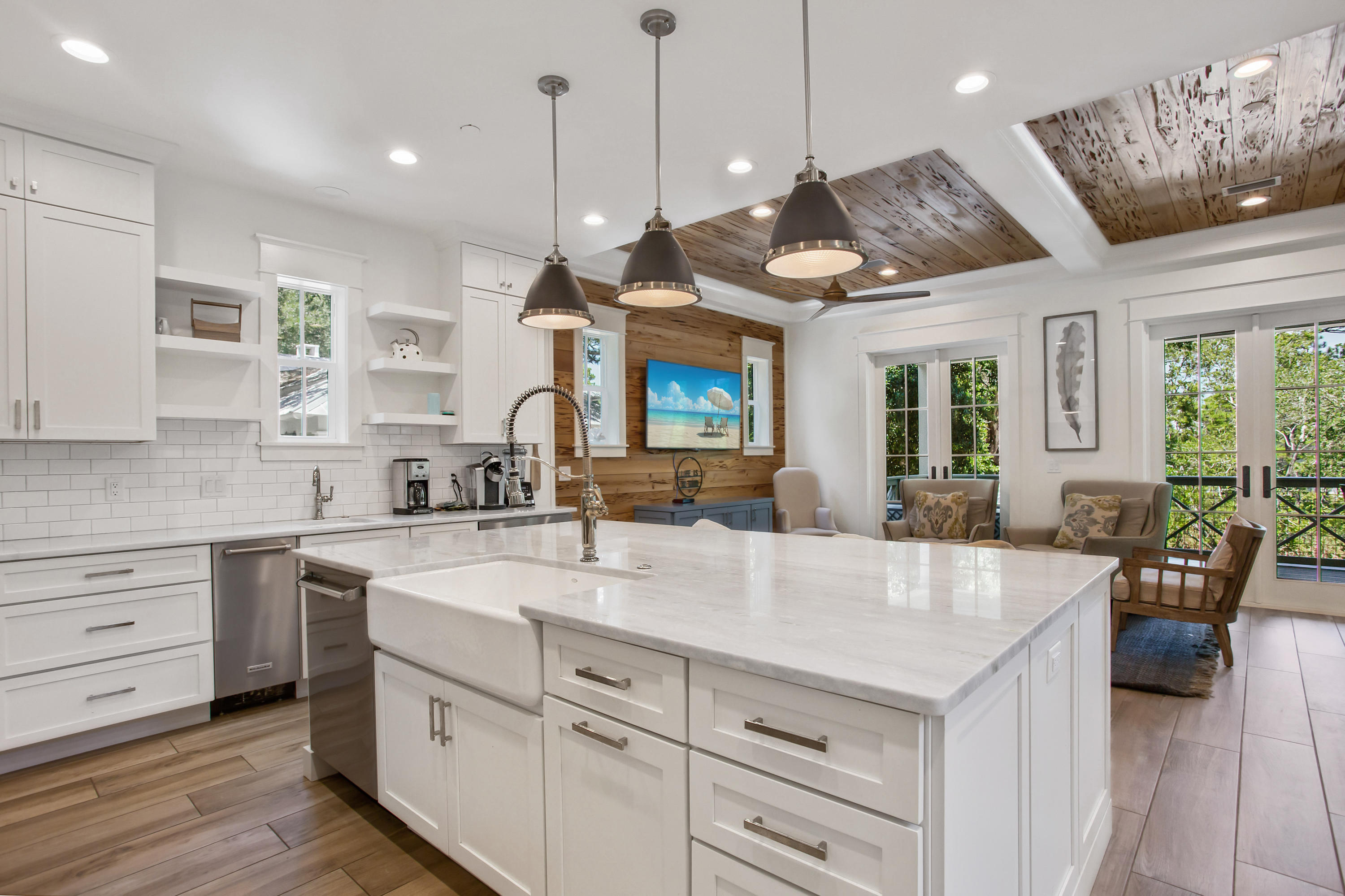 177 Grayton Trail Road Santa Rosa Beach, FL 32459 - Photo 12 of 78 a large kitchen with kitchen island a large counter space a sink appliances and living room view