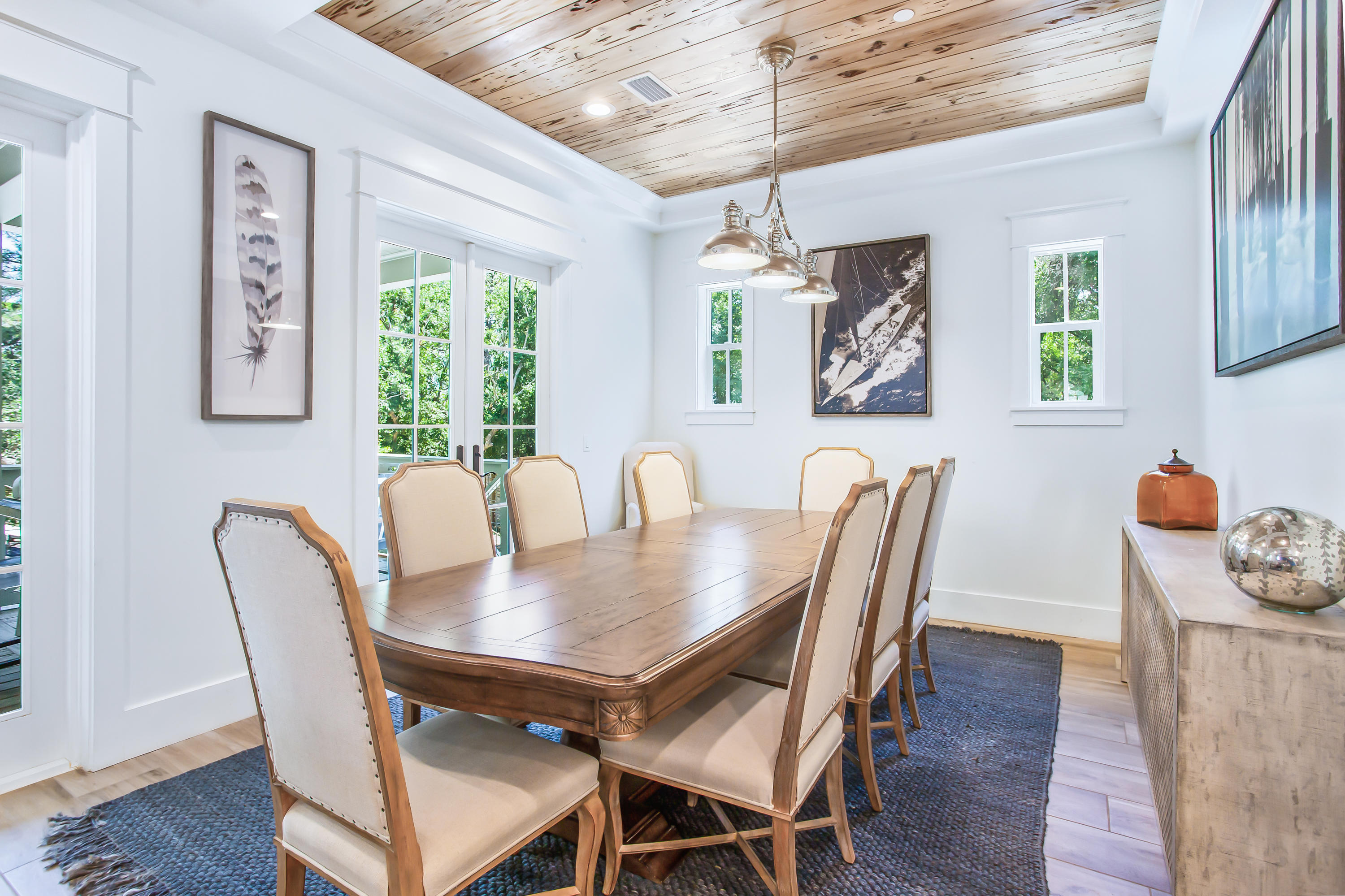 177 Grayton Trail Road Santa Rosa Beach, FL 32459 - Photo 15 of 78 a view of a dining room with furniture window and wooden floor