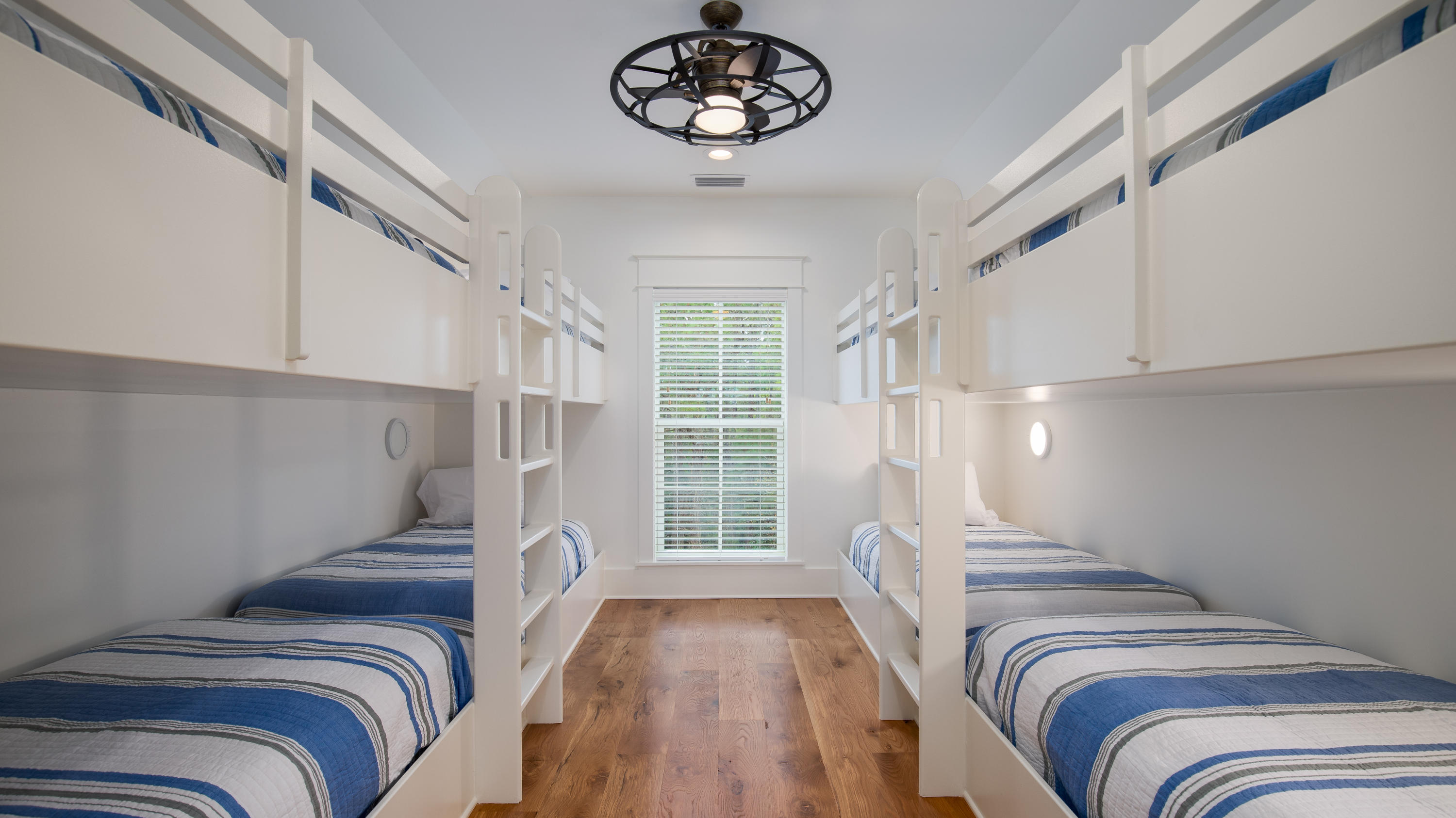 177 Grayton Trail Road Santa Rosa Beach, FL 32459 - Photo 30 of 78 a view of a bedroom with a bed and wooden floor