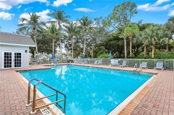 a view of a swimming pool with a patio