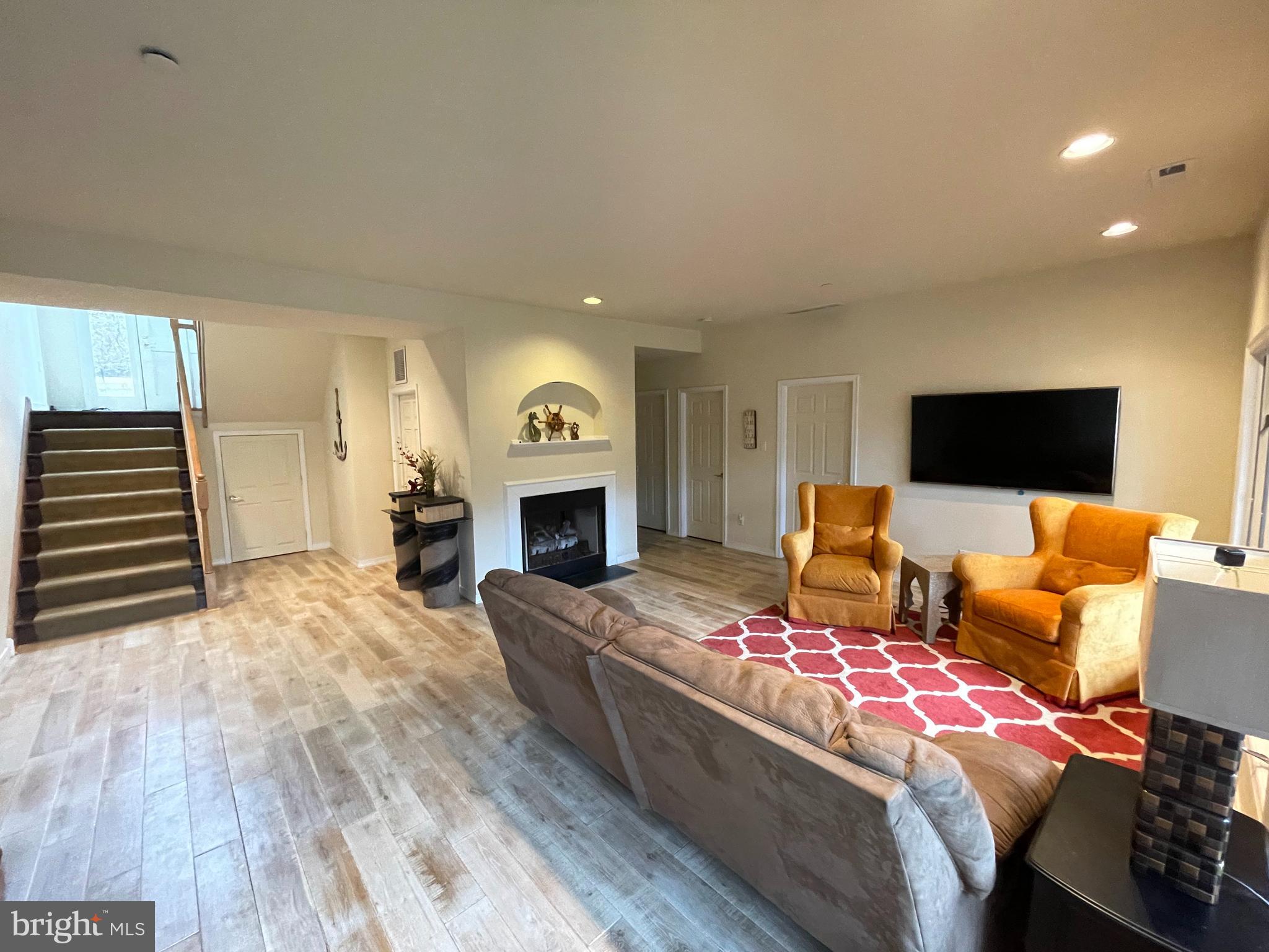 3300 Sawmill Road Newtown Square, PA 19073 - Photo 19 of 29 a living room with furniture and a fireplace