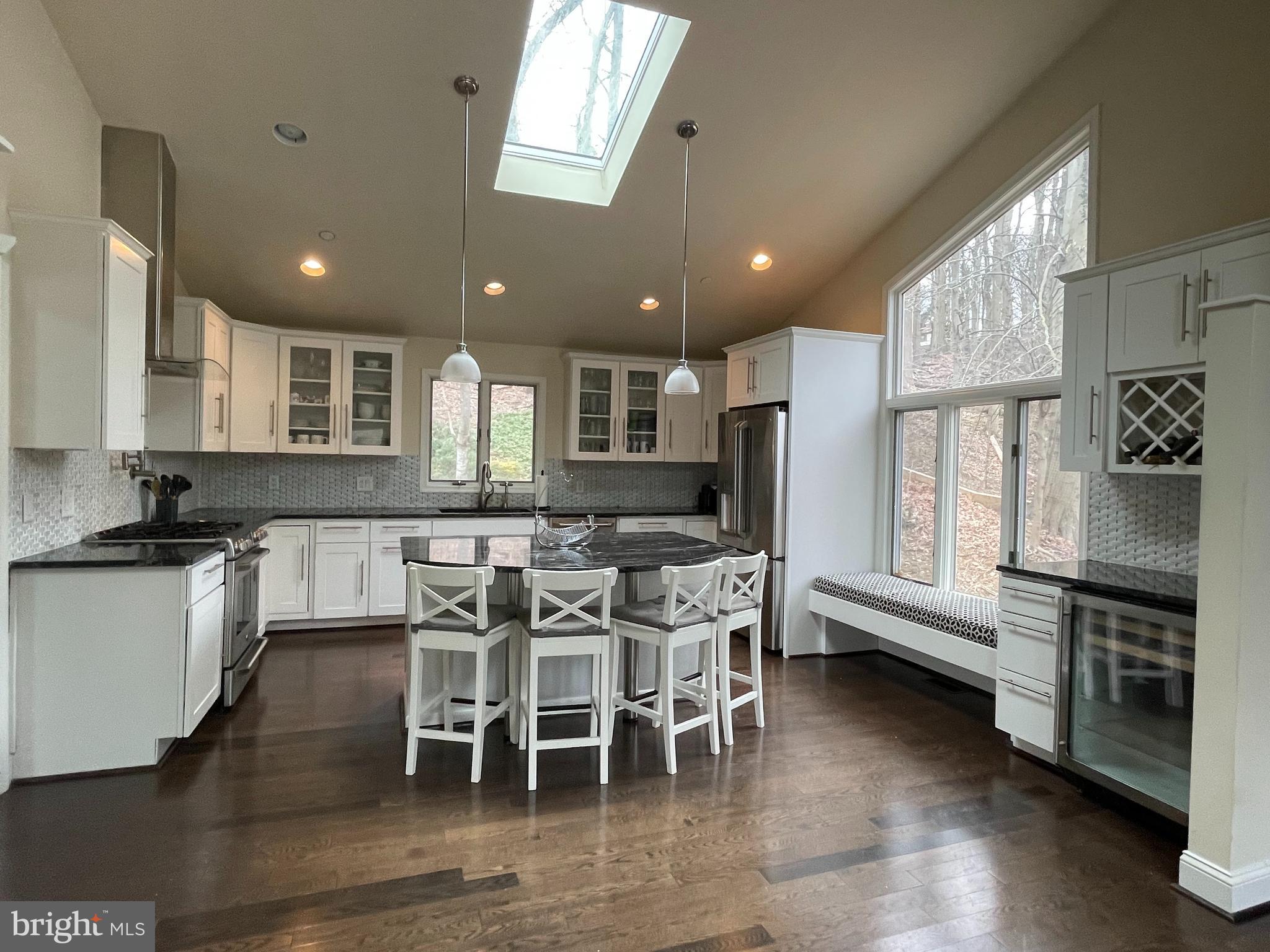 3300 Sawmill Road Newtown Square, PA 19073 - Photo 7 of 29 a kitchen with stainless steel appliances granite countertop table chairs sink and stove