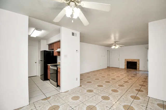 a view of a livingroom with a kitchen