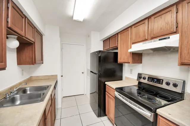 a kitchen with a stove and a microwave
