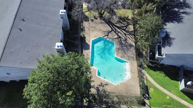 an aerial view of residential houses with outdoor space