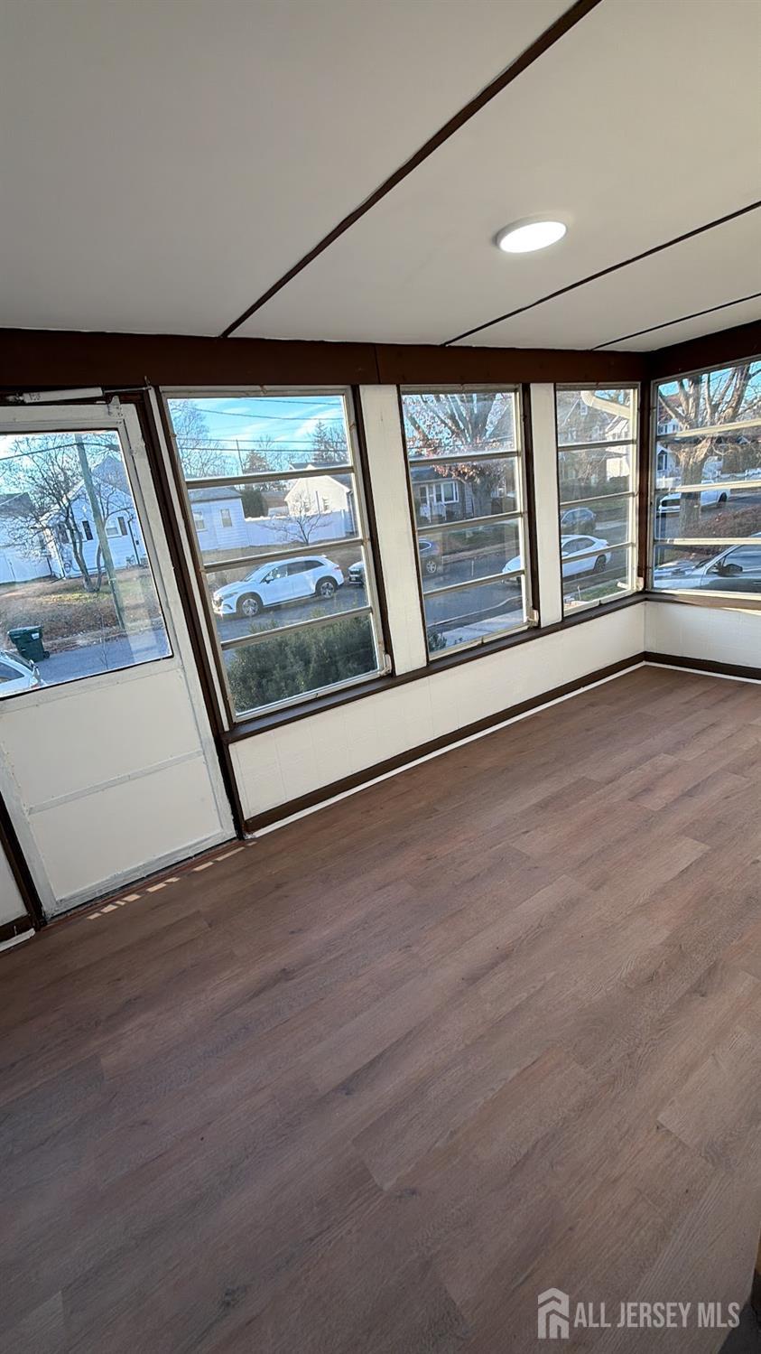 463 Valmere Avenue Piscataway, NJ 08854 - Photo 2 of 18 wooden floor in an empty room with a window