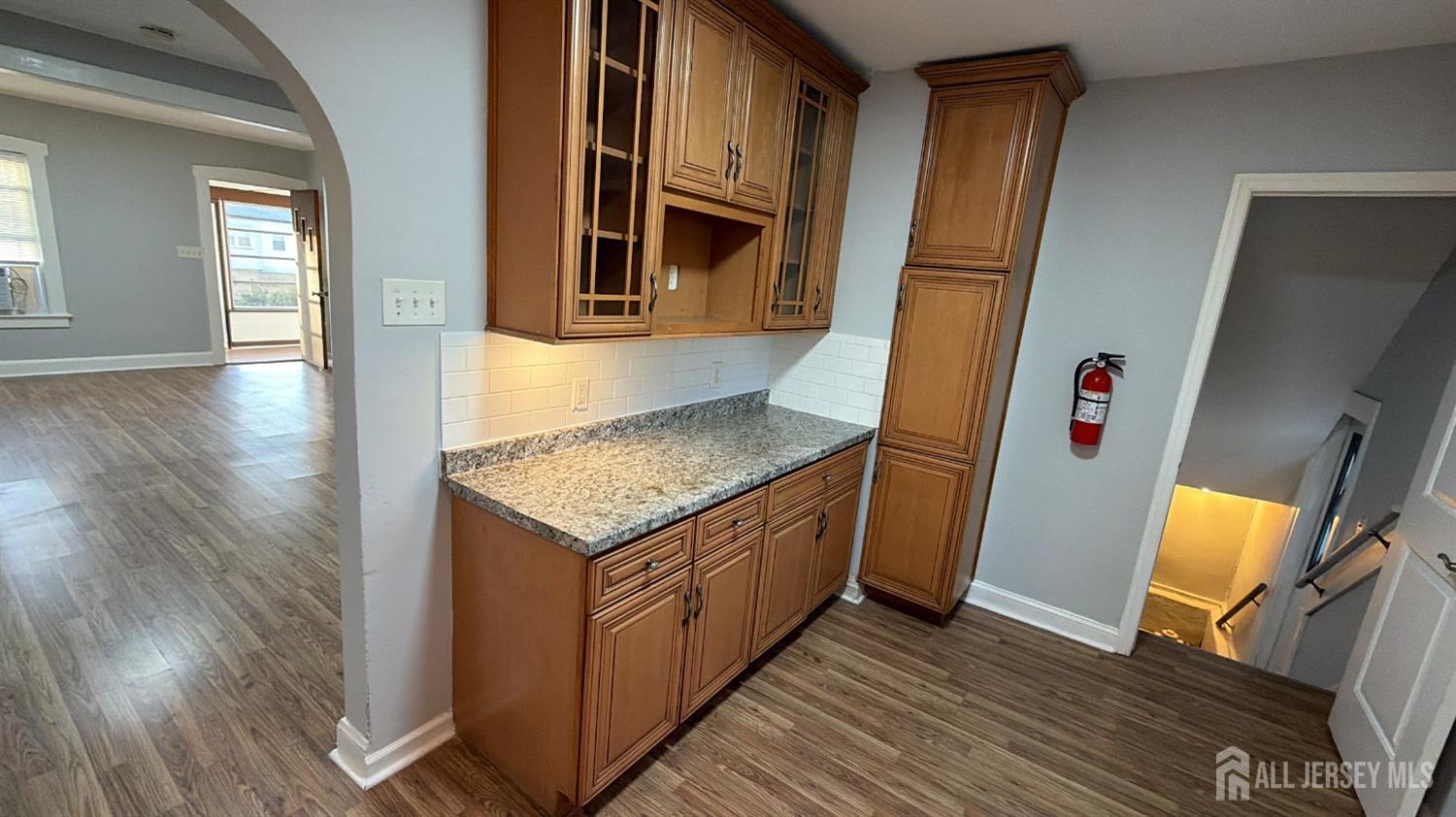 463 Valmere Avenue Piscataway, NJ 08854 - Photo 6 of 18 a view of a hallway with wooden floor and staircase