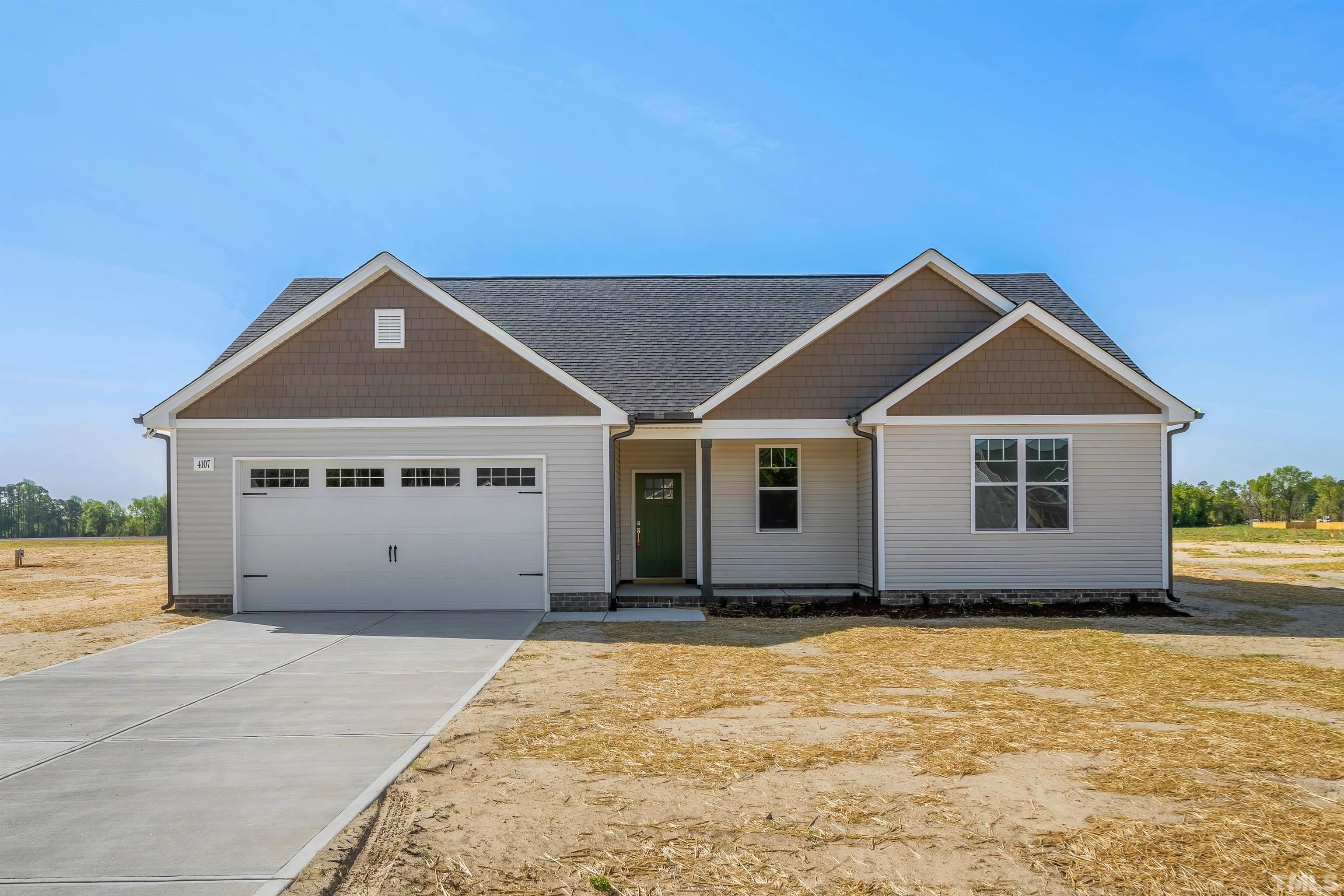 4107 Needham Road Bailey, NC 27807 - Photo 1 of 24 a house with yard in front of it