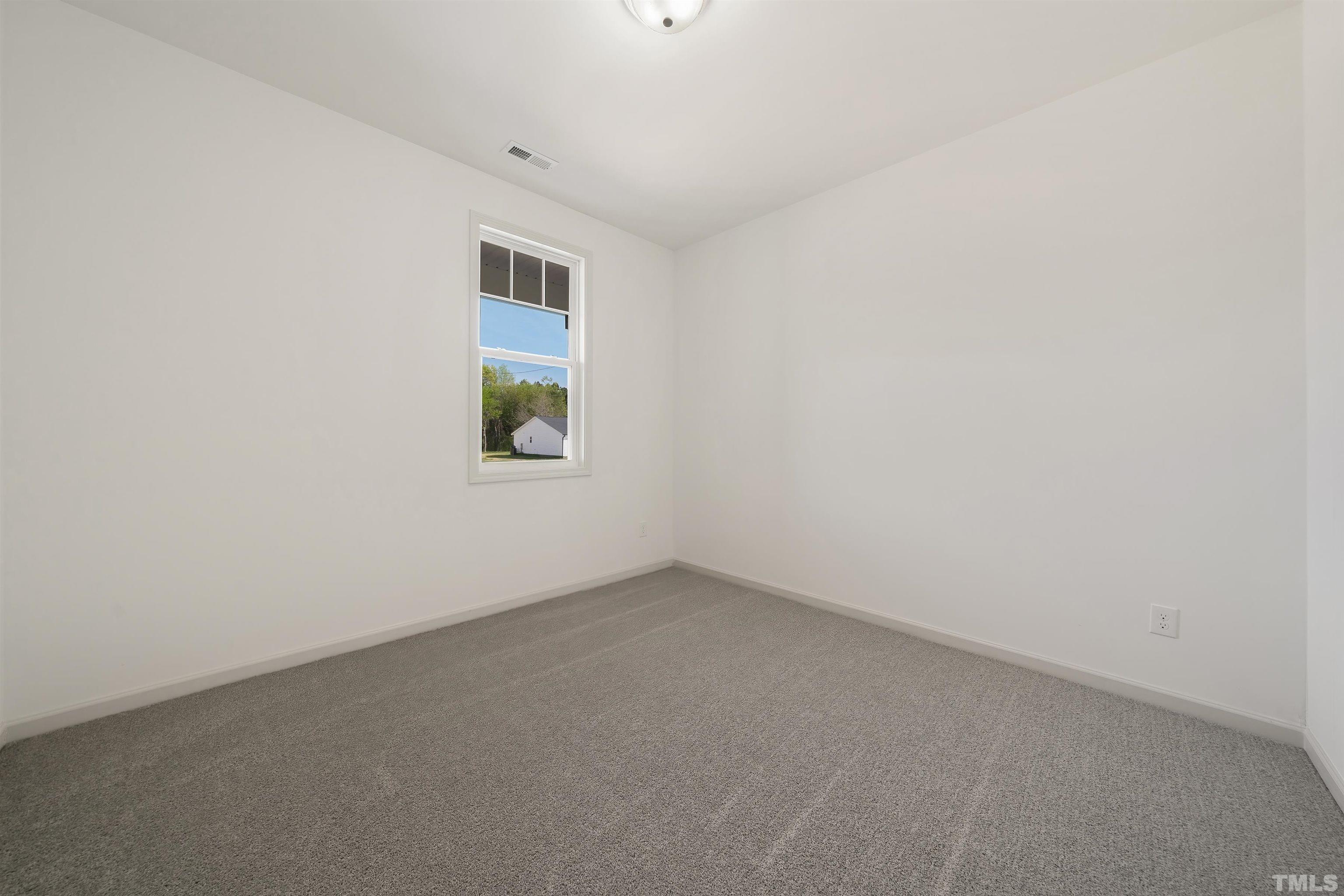 4107 Needham Road Bailey, NC 27807 - Photo 16 of 24 an empty room with a window