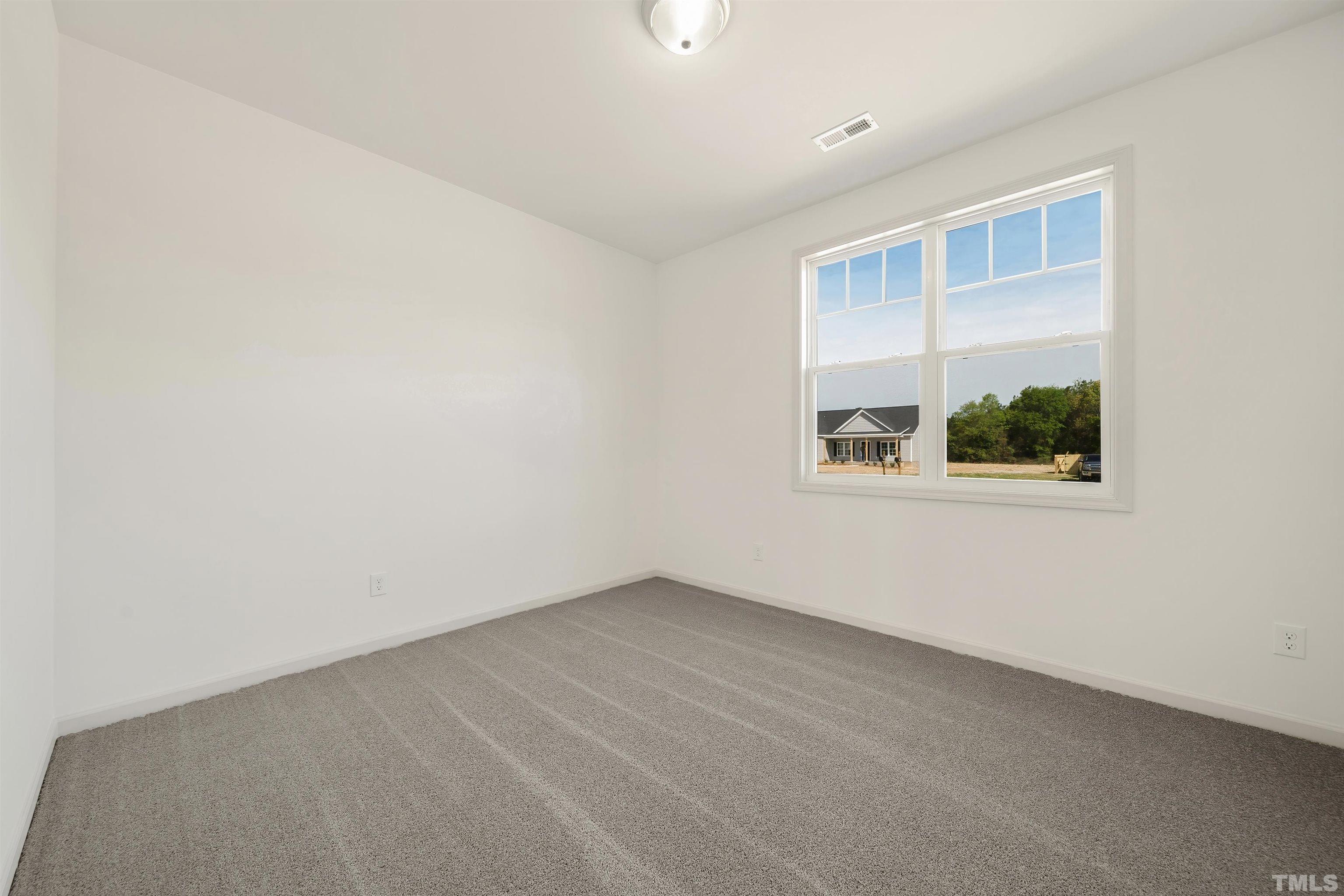 4107 Needham Road Bailey, NC 27807 - Photo 18 of 24 an empty room with a window