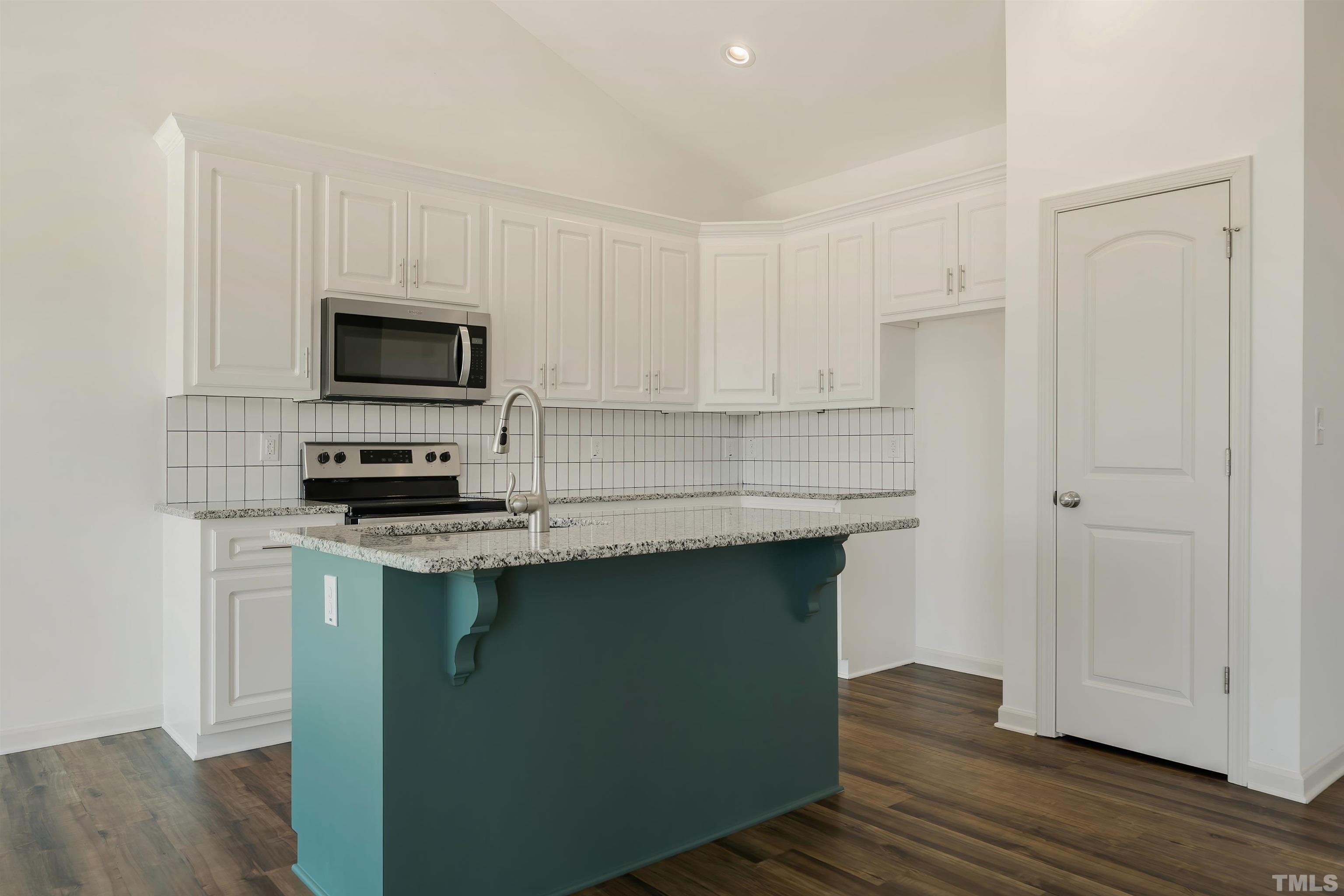 4107 Needham Road Bailey, NC 27807 - Photo 7 of 24 a kitchen with appliances a sink and cabinets