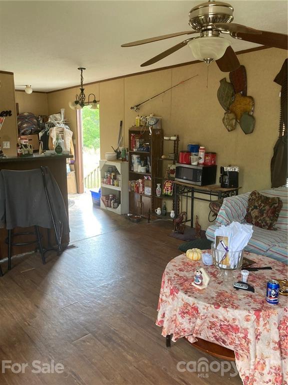 558 McGill Road Smyrna, SC 29743 - Photo 11 of 11 a bed room with a bed mirror and a chair