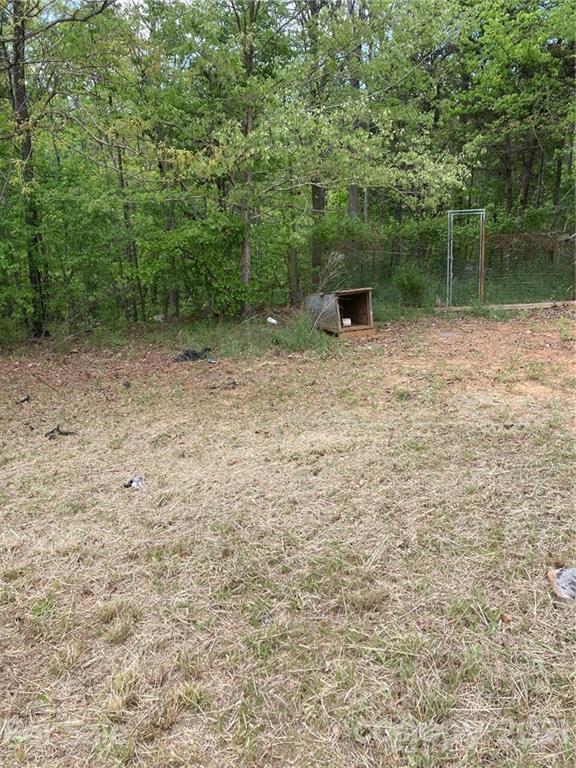 558 McGill Road Smyrna, SC 29743 - Photo 3 of 11 a view of a garden with a bench