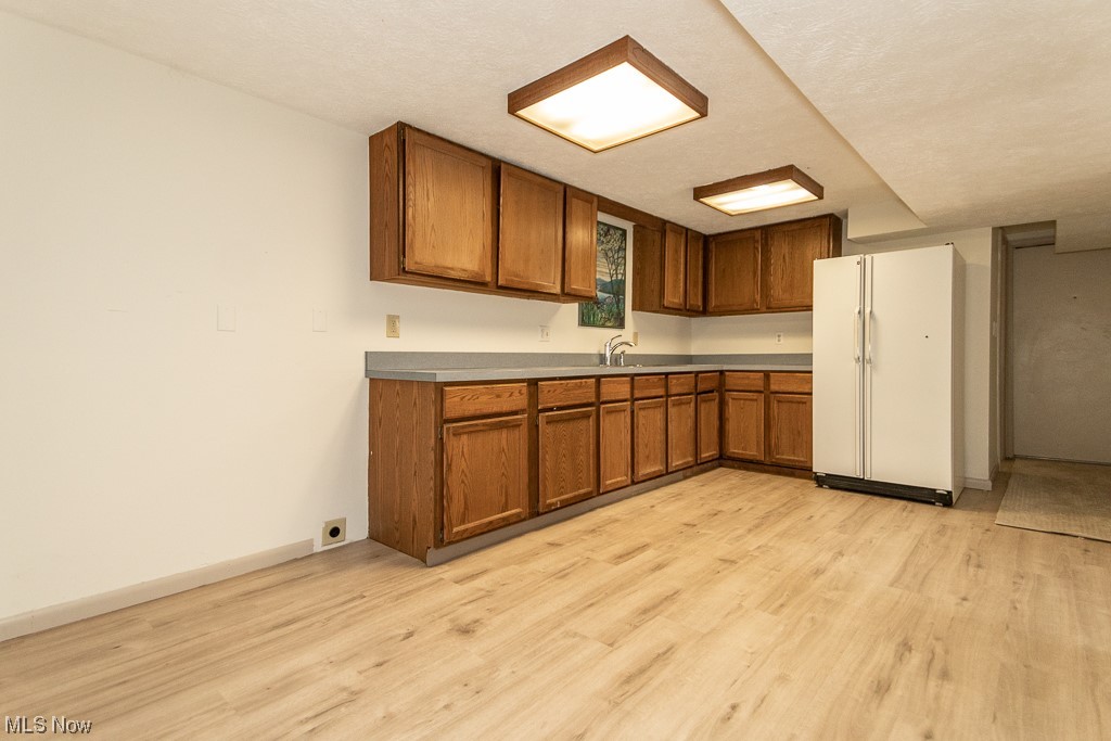11040 Fairmount Road Newbury, OH 44065 - Photo 33 of 35 Lower level eat-in-kitchen area with brand new laminate flooring.
