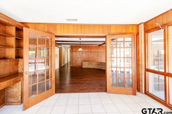 a kitchen with a refrigerator and a stove top oven