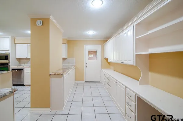 a view of a kitchen with wooden floor