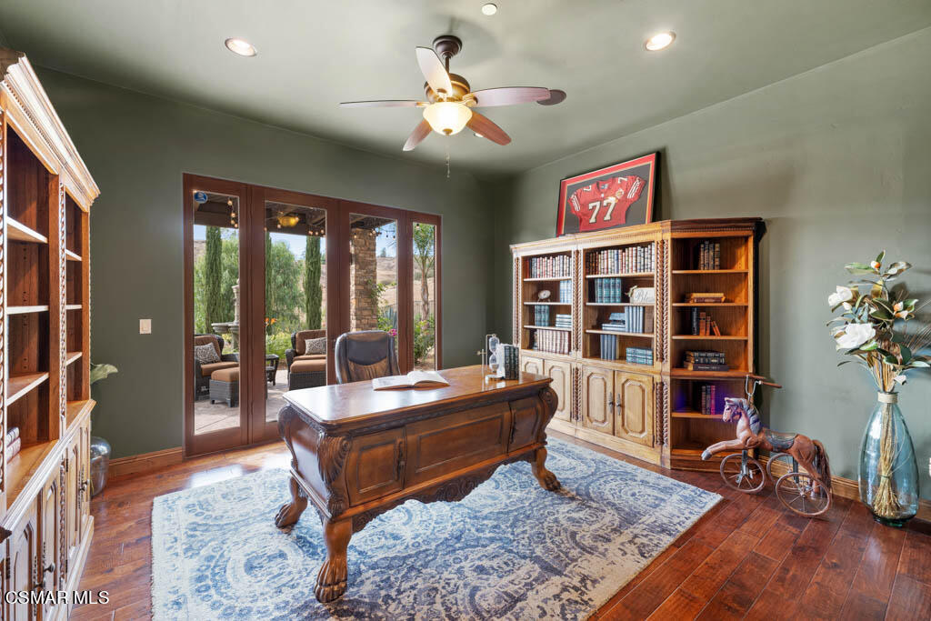 8577 Happy Camp Road Moorpark, CA 93021 - Photo 23 of 96 a living room with fireplace furniture and a book shelf