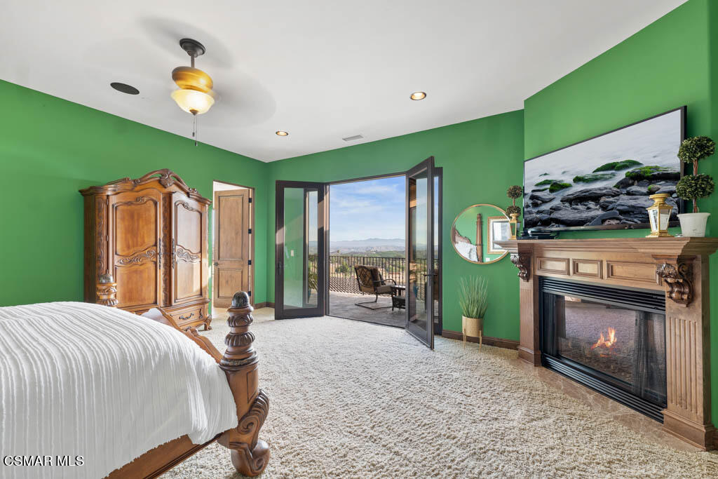 8577 Happy Camp Road Moorpark, CA 93021 - Photo 40 of 96 a bed room with a bed furniture and a fireplace