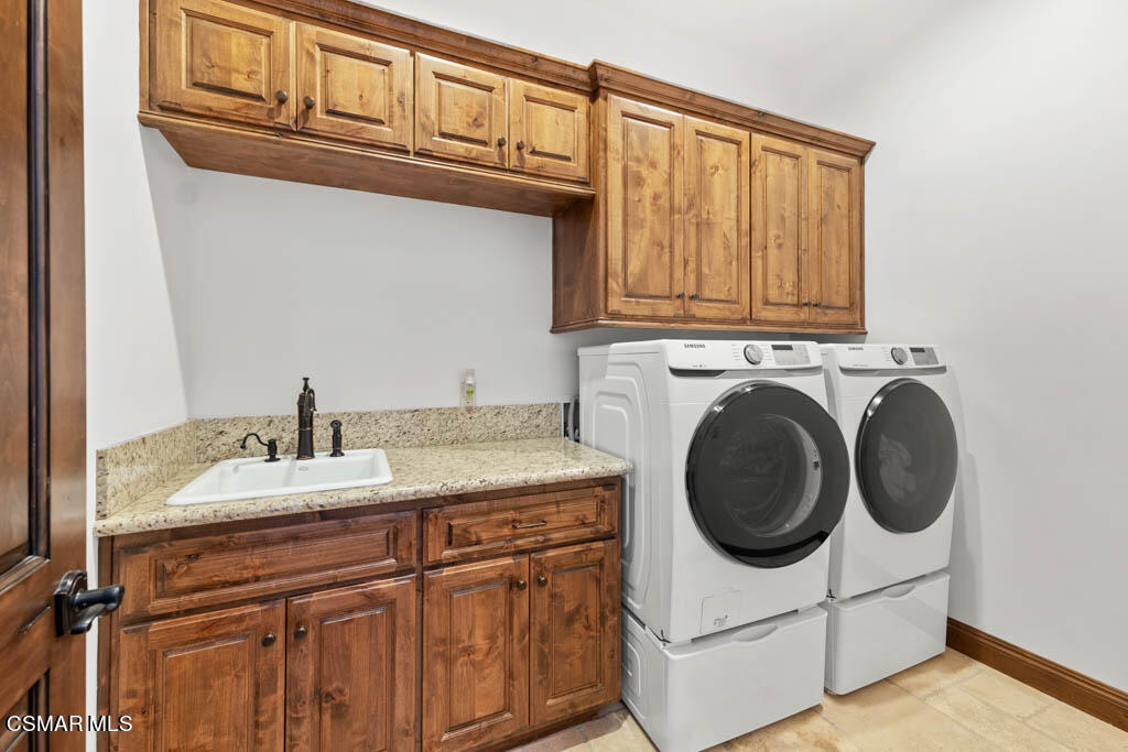 8577 Happy Camp Road Moorpark, CA 93021 - Photo 44 of 96 a utility room with sink dryer and washer