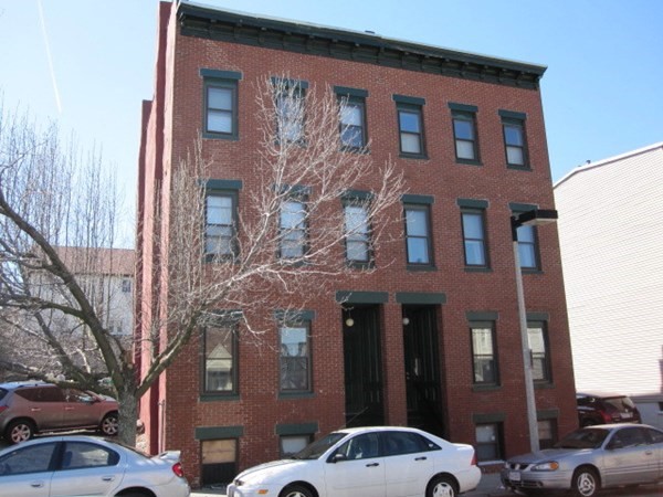 281 West 3rd Street, Unit 1 Boston, MA 02127 - Photo 1 of 11 a front view of a building with parking space