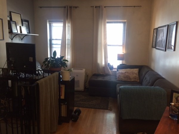 281 West 3rd Street, Unit 1 Boston, MA 02127 - Photo 3 of 11 a living room with furniture and a flat screen tv