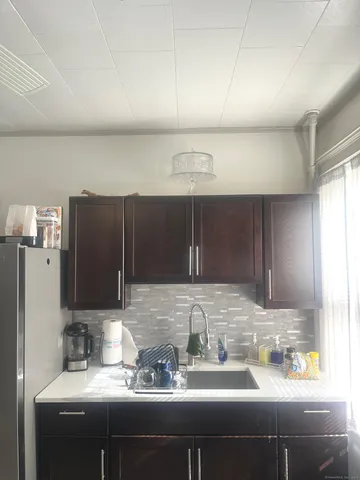 a kitchen with a sink and cabinets