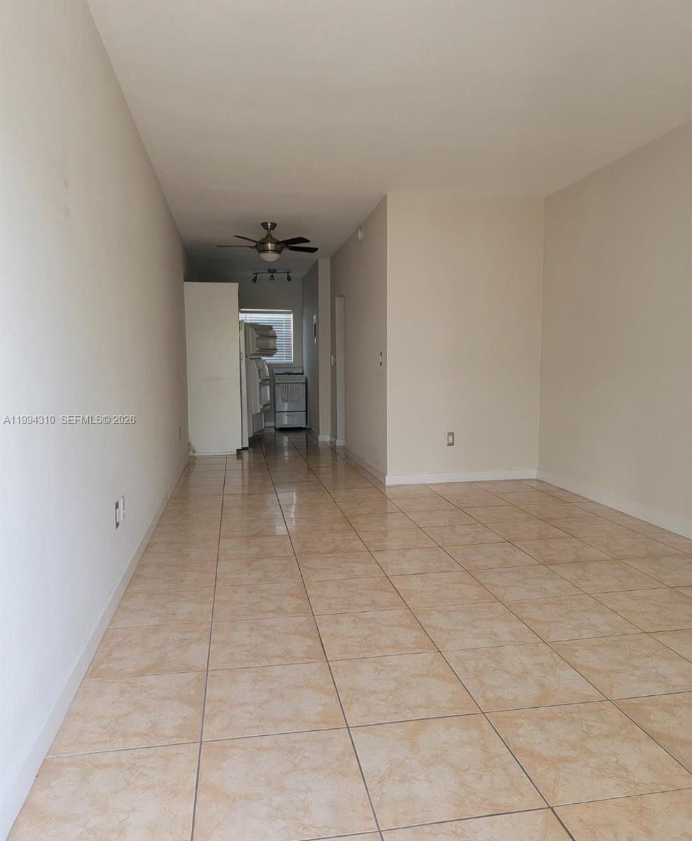 620 76th Street, Unit 11 Miami Beach, FL 33141 - Photo 2 of 14 a view of a livingroom with a cabinets