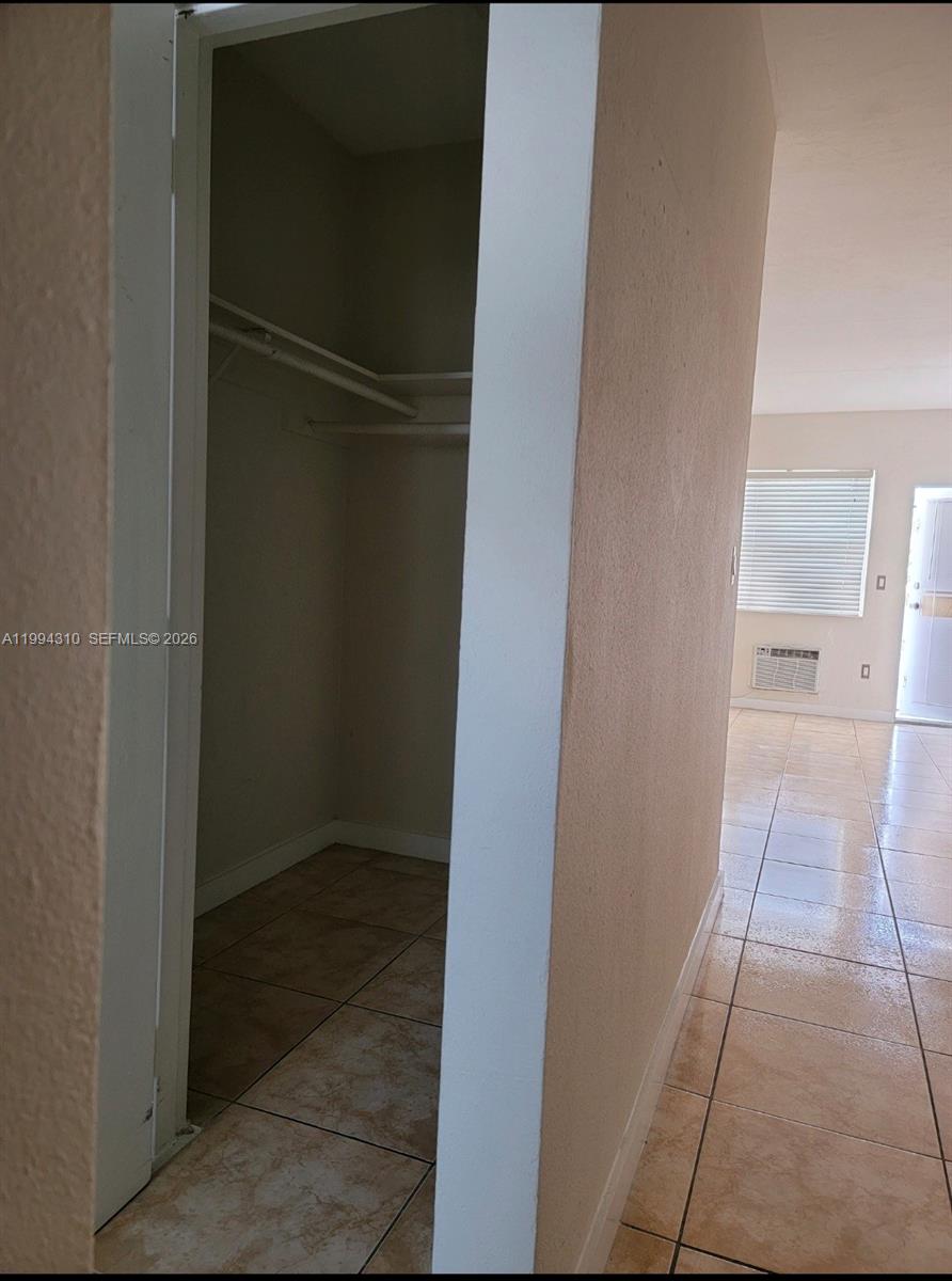 620 76th Street, Unit 11 Miami Beach, FL 33141 - Photo 5 of 14 a view of walk in closet