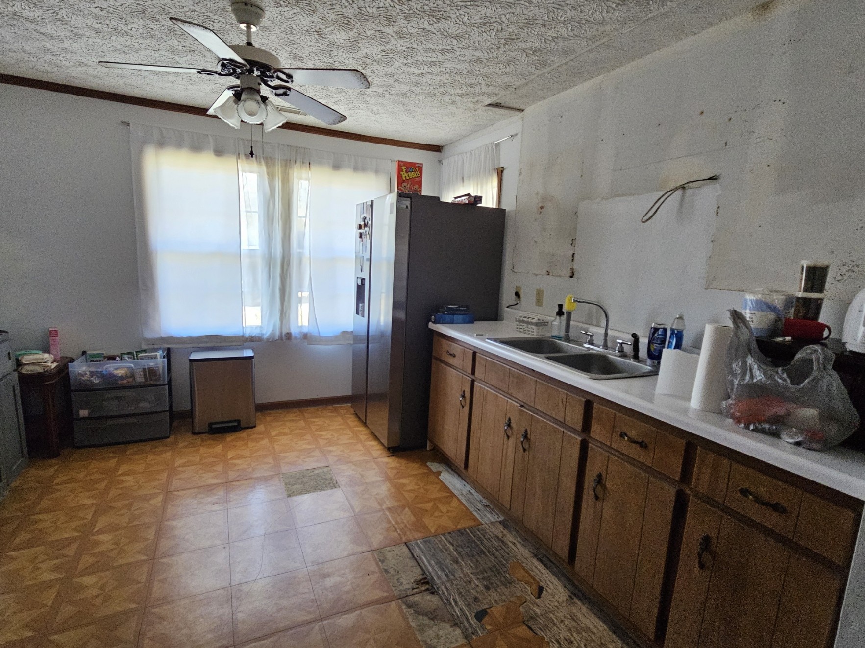 210 Twin Oaks Road McMinnville, TN 37110 - Photo 15 of 35 a kitchen with granite countertop a refrigerator and a sink