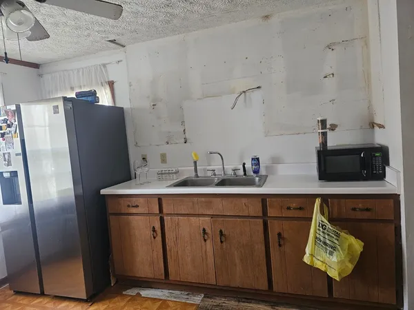 a bathroom with a sink toilet and window