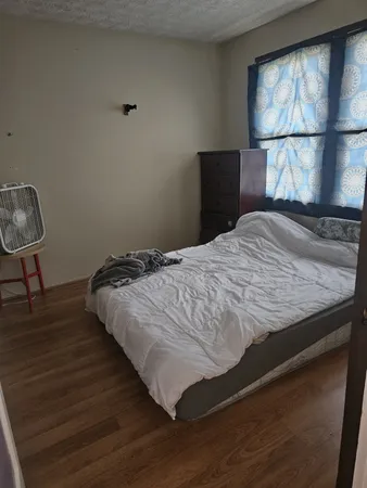 a view of an entryway with wooden floor