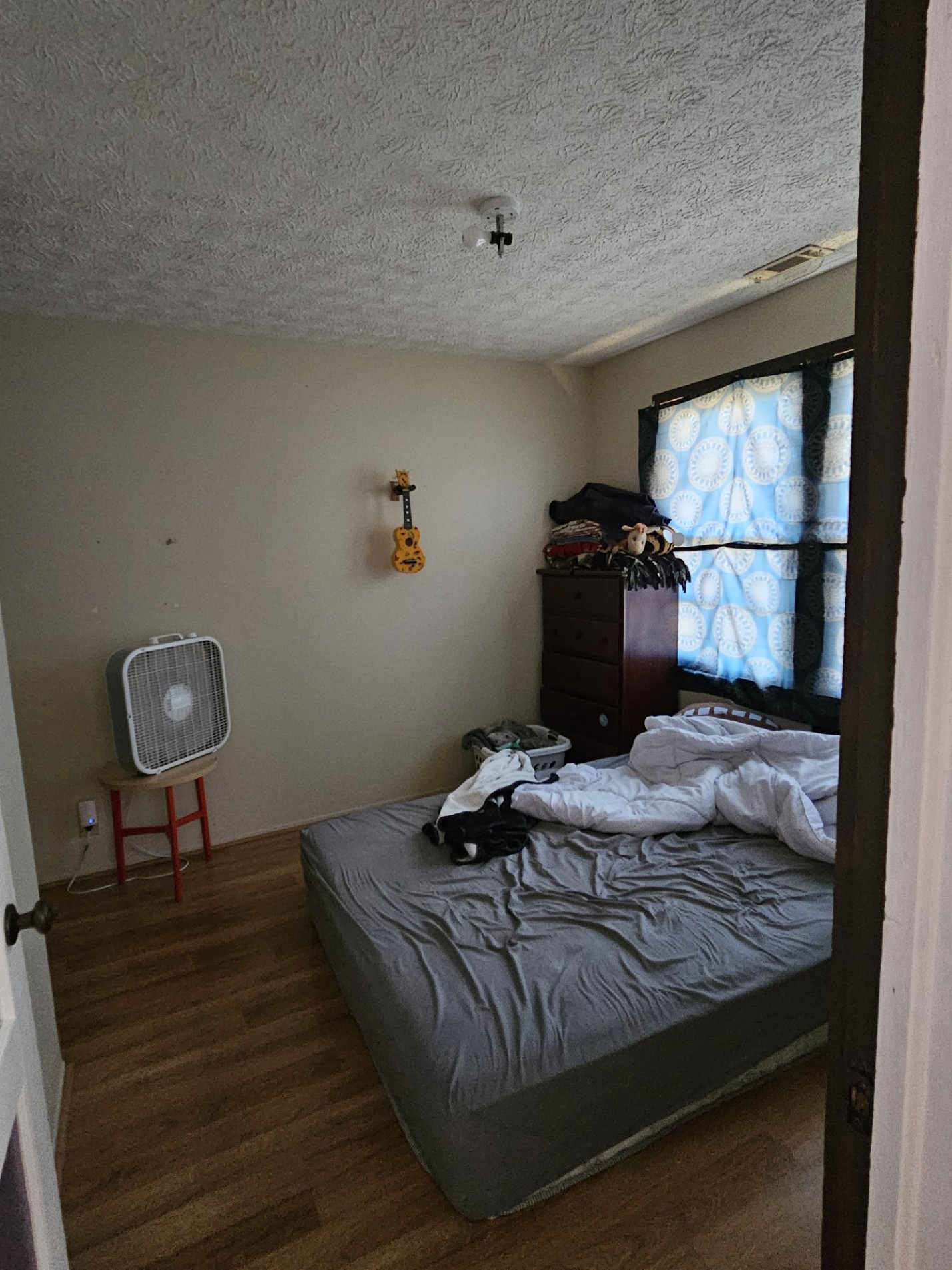 210 Twin Oaks Road McMinnville, TN 37110 - Photo 21 of 35 a bedroom with a bed and wooden floor